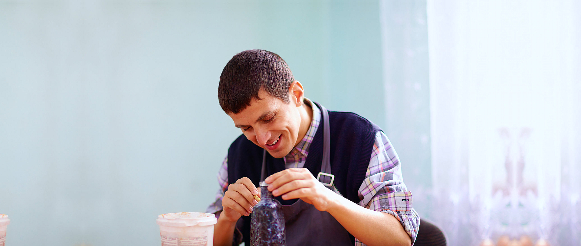 man with disability engaged in craftsmanship on practical lesson