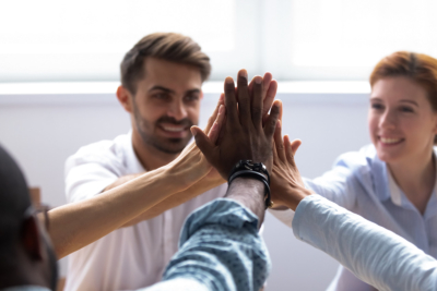 Close up human hands giving high five